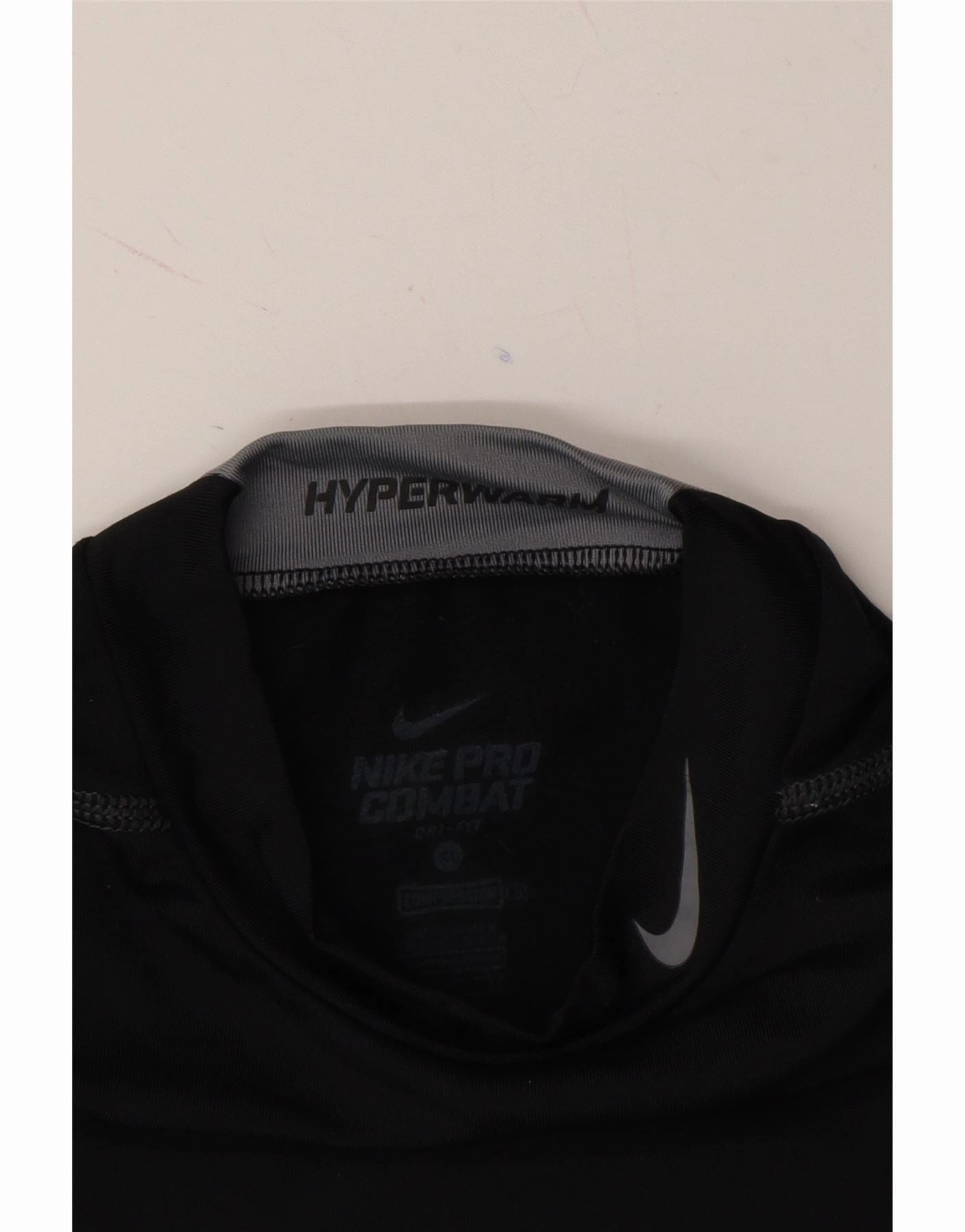 NIKE Girls Dri Fit Graphic Top Long Sleeve 13-14 Years XL Black Polyester